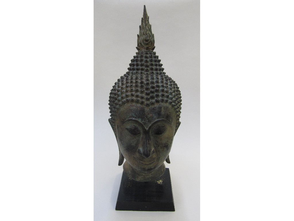 Appraisal: Verdigris metal Thai Buddha head on wooden stand