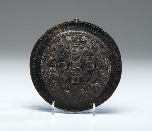 Appraisal: Chinese th century A rounded bronze mirror decorated with a