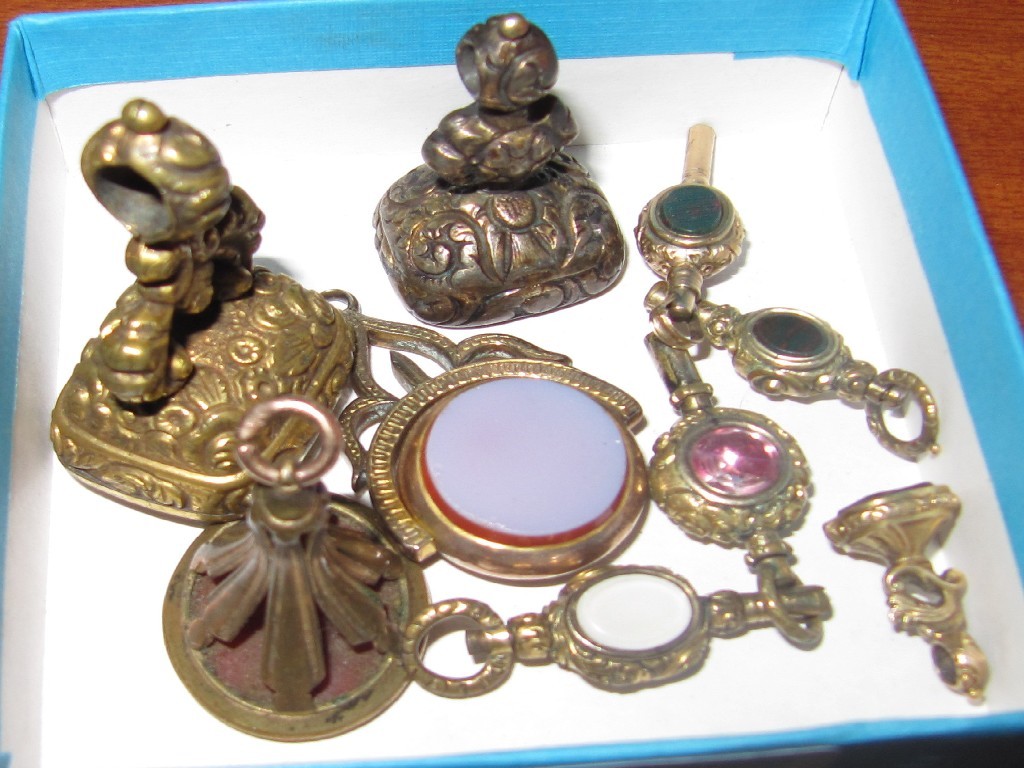 Appraisal: Lot comprising four watch fobs and four keys