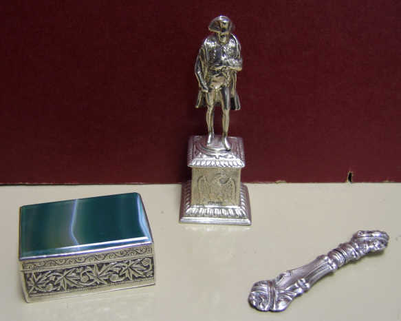 Appraisal: CONTINENTAL SILVER NAPOLEON STATUE AND TWO BOXES Comprising a miniature