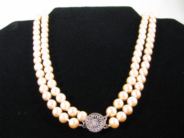 Appraisal: Natural cultured pink - row pearl necklace Measures long -