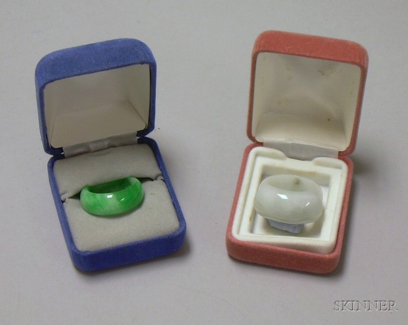 Appraisal: Two Jade Saddle Rings one white jade the other apple