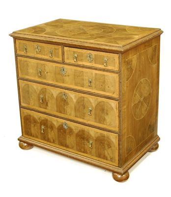 Appraisal: A walnut oyster veneered chest in William and Mary style