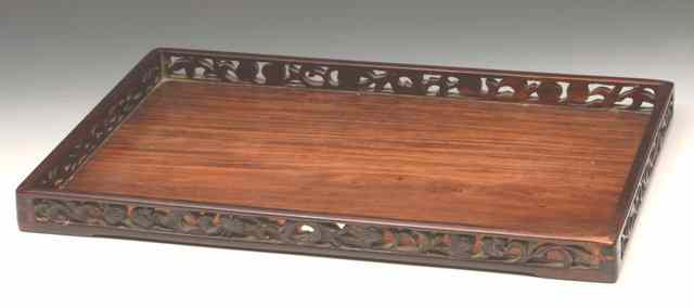 Appraisal: A CHINESE HARDWOOD RECTANGULAR TRAY the pierced border with carved