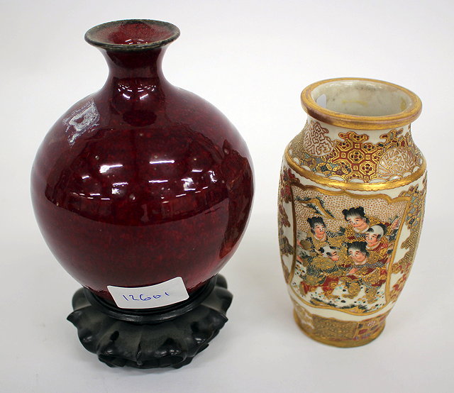 Appraisal: A POTTERY VASE decorated in sang de boeuf glaze complete