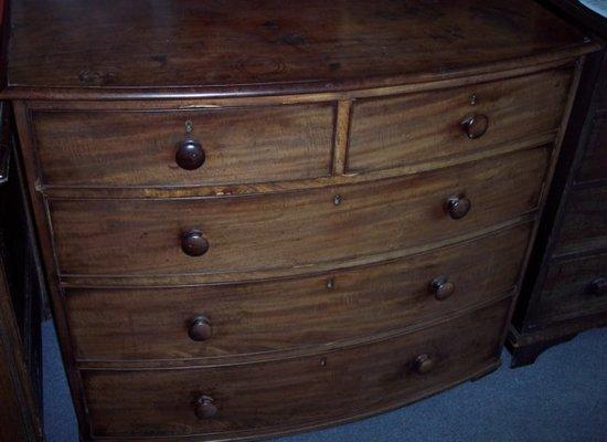 Appraisal: A George III mahogany bowfront chest of two short and