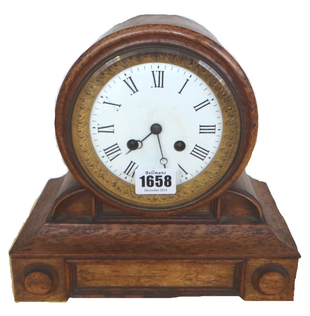 Appraisal: An oak cased drum mantel clock late th century on