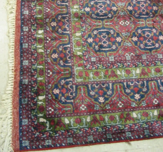 Appraisal: HAND KNOTTED ORIENTAL CARPET repeating rows of blue geometric lozenges