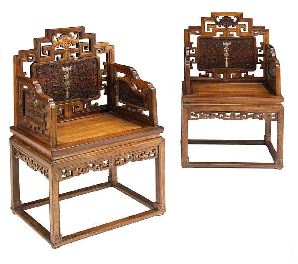 Appraisal: A pair of Qing style mixed hardwood armchairs th Century