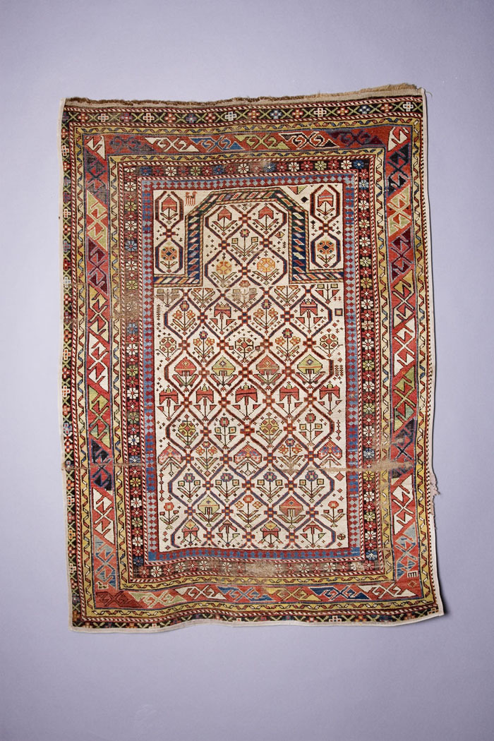 Appraisal: SHIRVAN PRAYER RUG EAST CAUCASUS The polychrome floral bud lattice