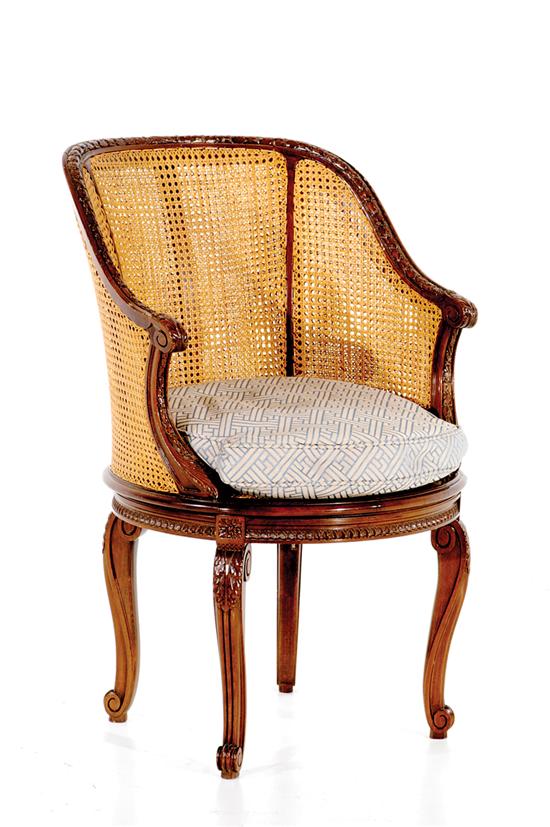 Appraisal: French style fruitwood and cane bergere circa barrel back with