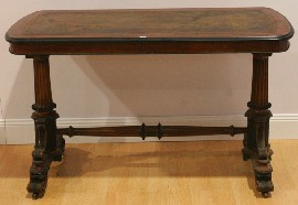 Appraisal: A Victorian walnut and ebonised library table cm wide cm