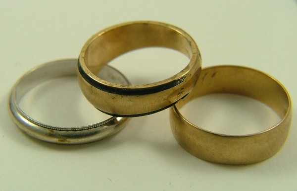 Appraisal: THREE GOLD BANDS a diamond and K yellow gold a