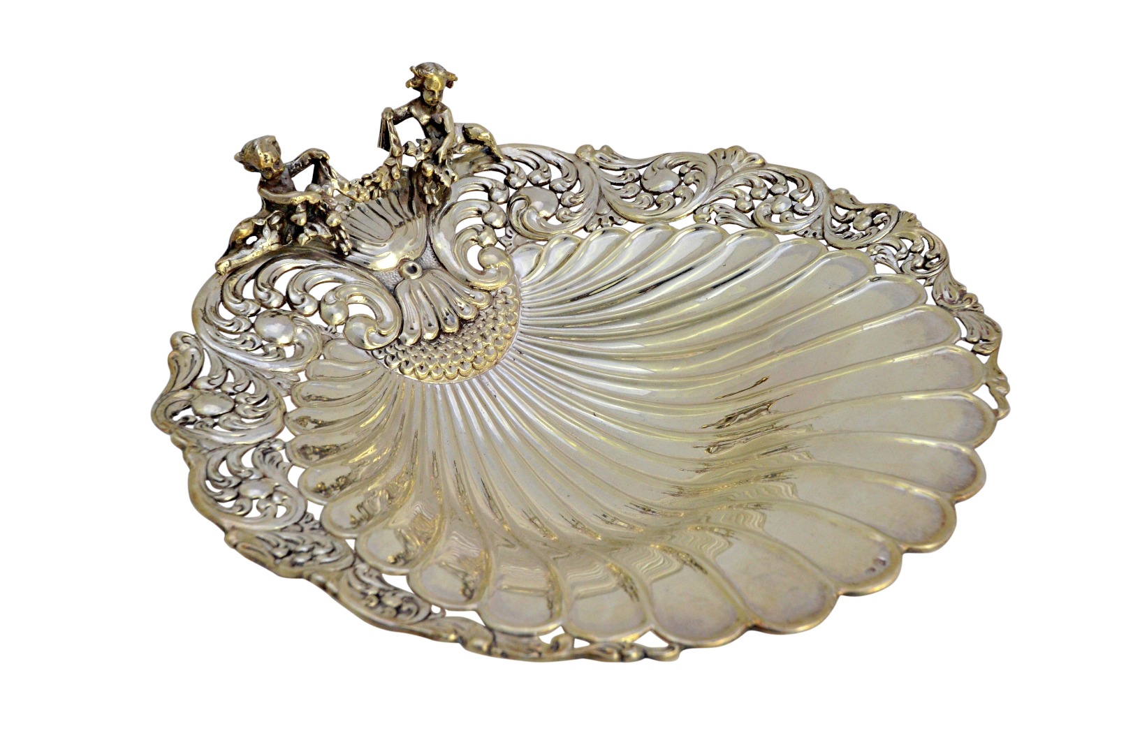 Appraisal: A European biscuit dish of scallop shell shaped form decorated