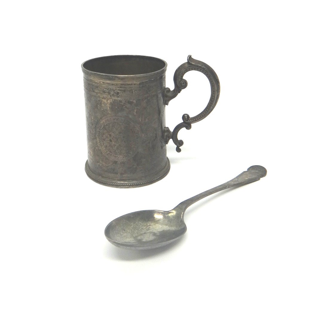 Appraisal: A Victorian silver christening mug with engraved decoration beaded foot