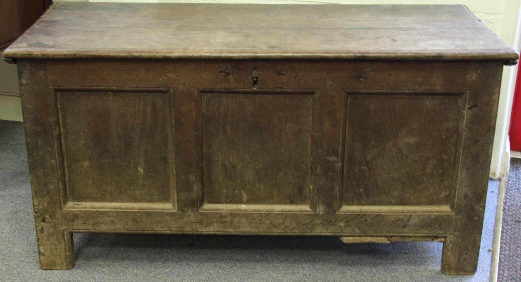 Appraisal: An early th Century oak coffer with triple panel front