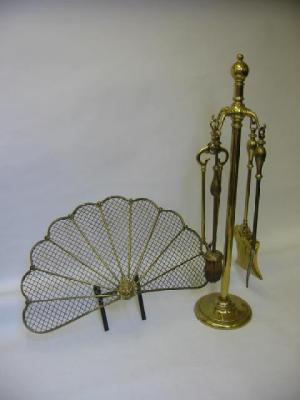 Appraisal: A BRASS WIREWORK FIRESCREEN of fan form centred by a