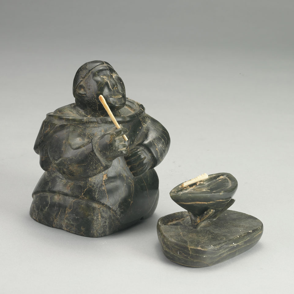 Appraisal: UNIDENTIFIED Inukjuak KNEELING WOMAN TENDING KUDLIK stone ivory x x