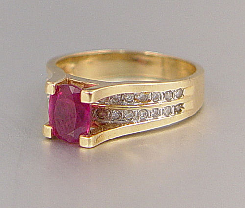 Appraisal: CT RUBY with DIAMONDS RING K yellow gold ring centers