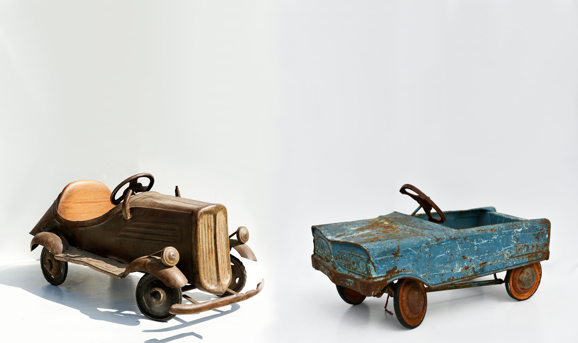 Appraisal: VINTAGE PEDAL CARS Although very rusted this pedal car has