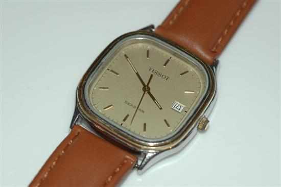 Appraisal: A TISSOT SEA-STAR QUARTZ WRISTWATCH WITH BATON NUMERALS AND DATE