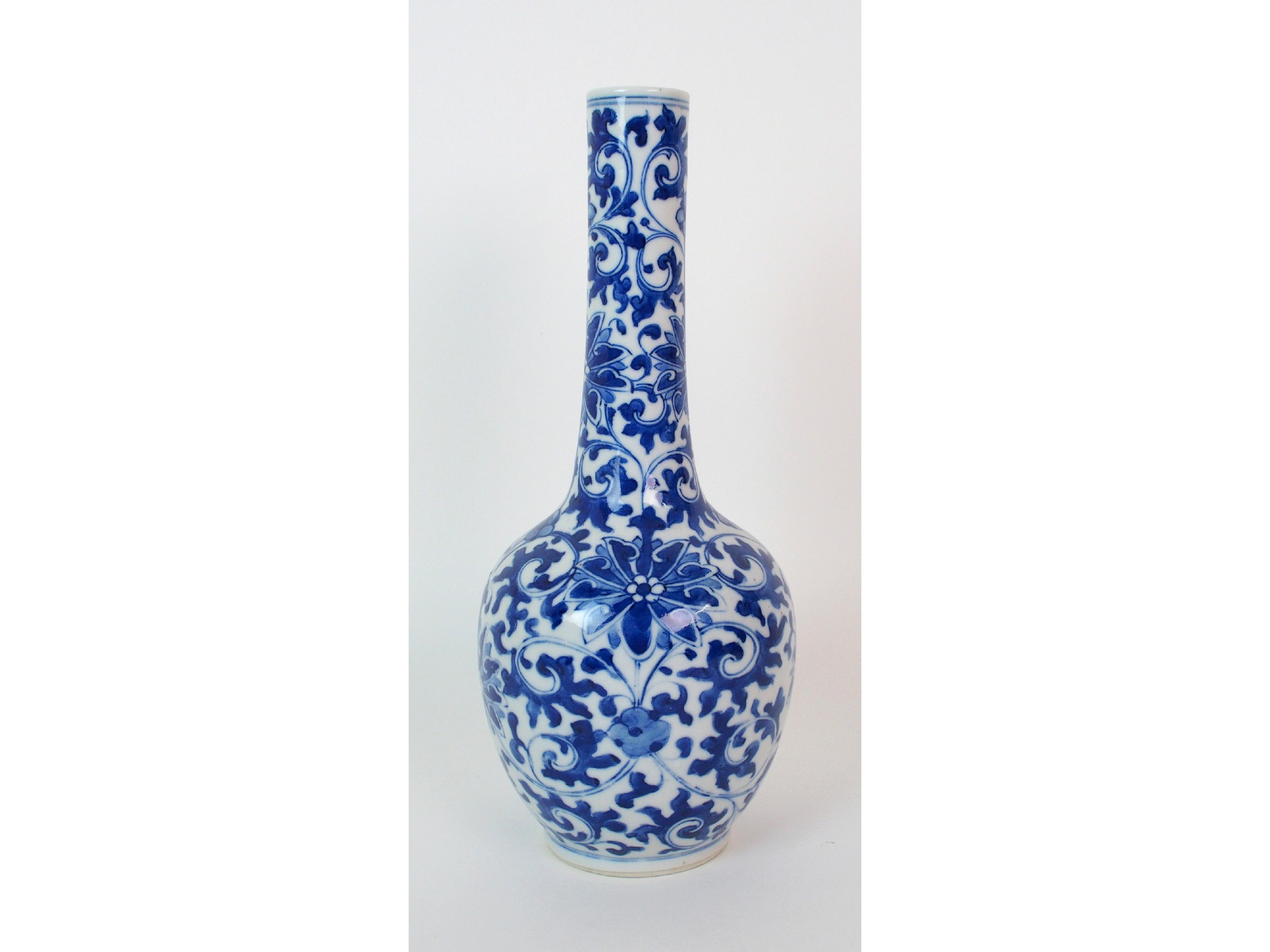 Appraisal: A Chinese blue and white bottle shaped vasepainted with peonies