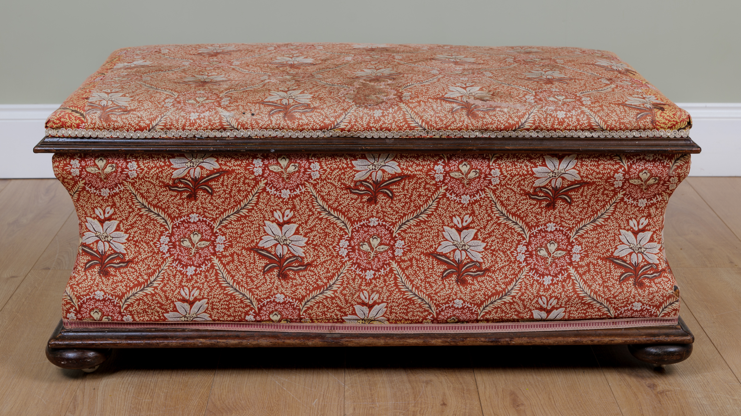 Appraisal: A Victorian rectangular ottoman stool with waisted sides beneath a