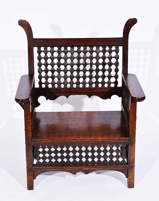 Appraisal: Liberty Co of LondonMoorish oak armchair circa - possibly designed