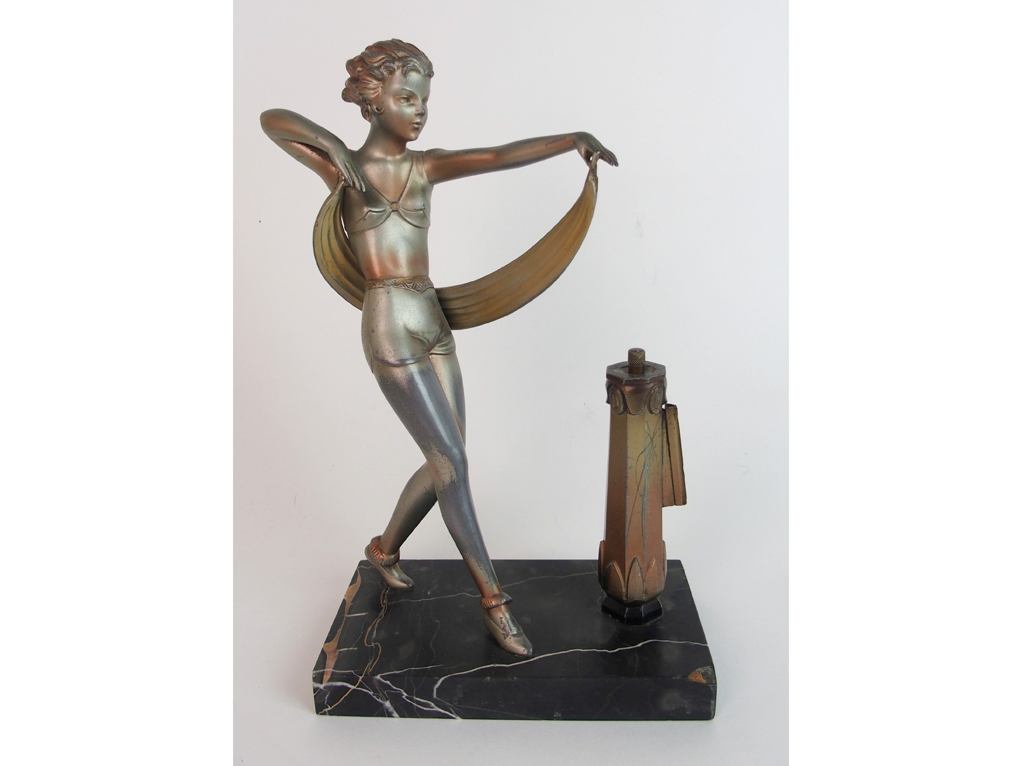 Appraisal: An Art Deco spelter lady figure strikerafter a model by