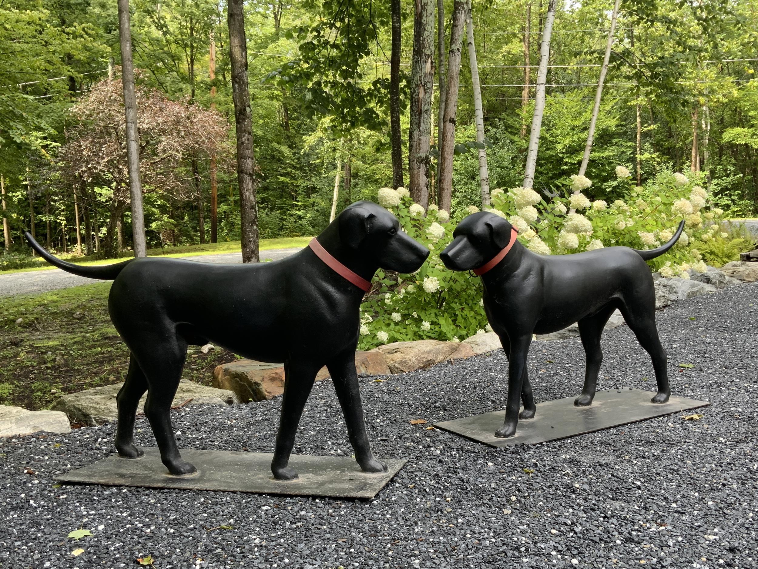 Appraisal: A PAIR OF POULTNEY FOUNDRY CAST IRON DOG SCULPTURES An