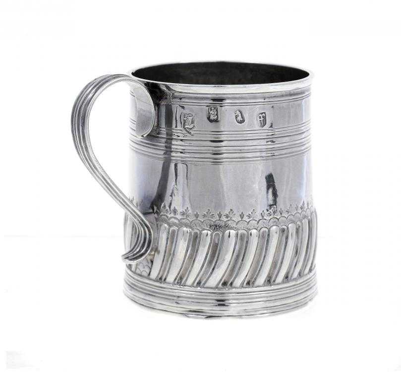 Appraisal: A WILLIAM III MUG the lower body spirally lobed and