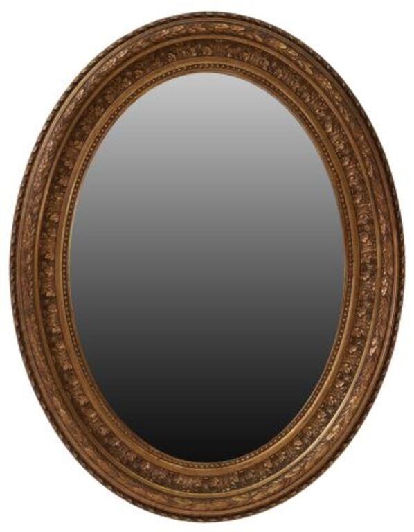 Appraisal: Italian giltwood wall mirror early th c having molded ovular