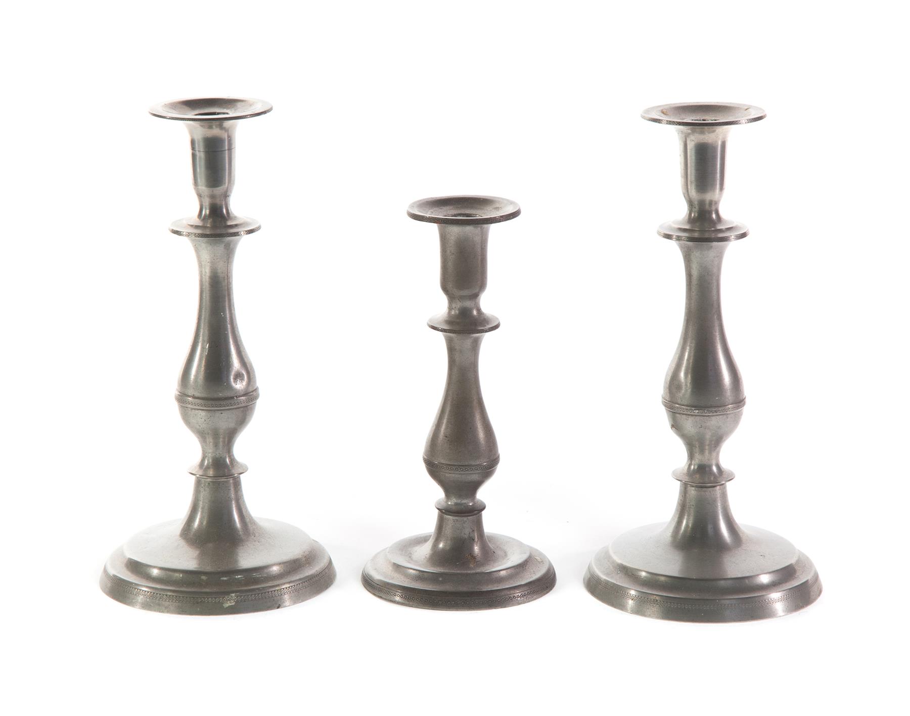 Appraisal: THREE SELLEW PEWTER CANDLESTICKS Ohio mid th century Pair with