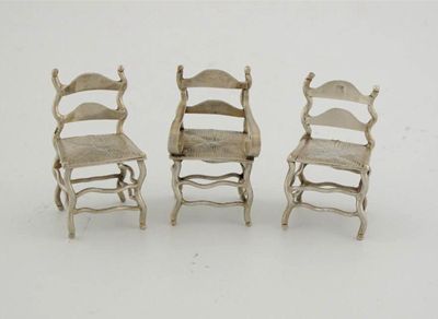 Appraisal: A pair of ladder back chairs with imitation rush seats