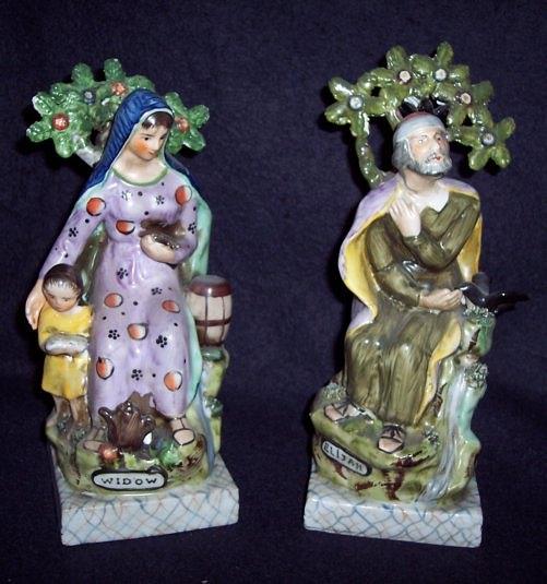 Appraisal: A pair of Staffordshire Ralph Wood type figures Elijah and