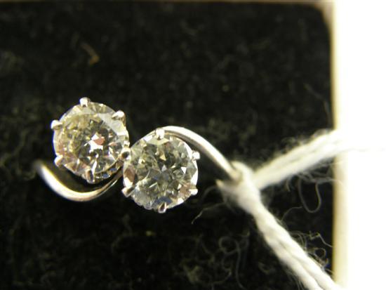 Appraisal: Diamond two stone crossover style ring comprising two round brilliant