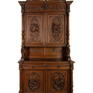 Appraisal: A German Carved Oak Hunt Cabinet th Century Height x