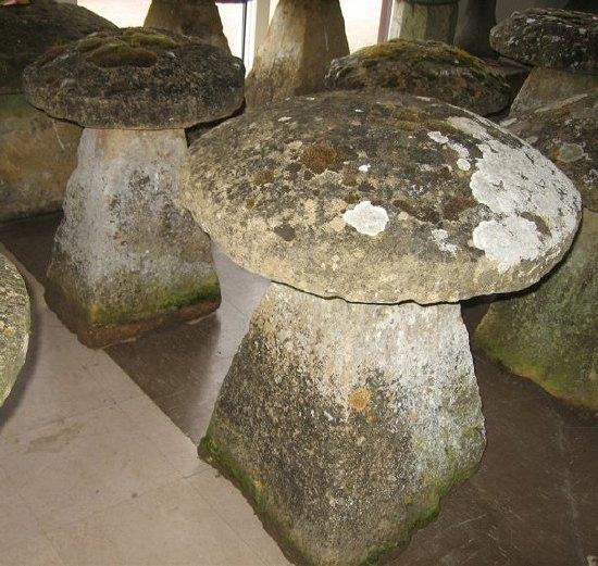 Appraisal: Two th Century Cotswold stone staddle stones with square tapering