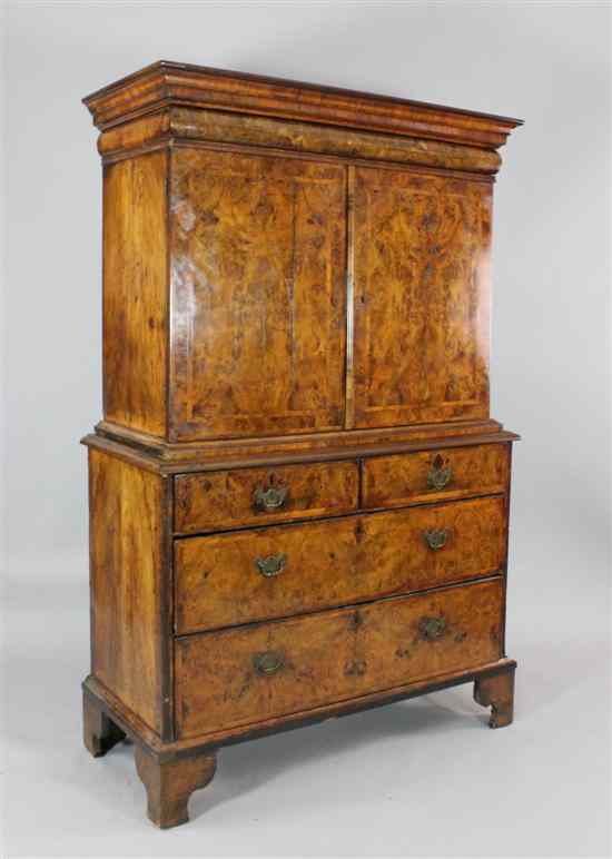 Appraisal: An early th century burr walnut and herringbone inlaid cabinet