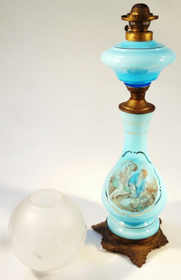 Appraisal: A late thC overlay blue glass lamp with metal fittings