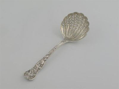 Appraisal: A Victorian Bacchanalian pattern sugar sifter spoon traces of gilding