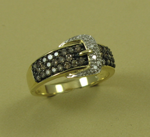 Appraisal: CHAMPAGNE DIAMOND AND FOURTEEN KARAT GOLD RING set with round-cut