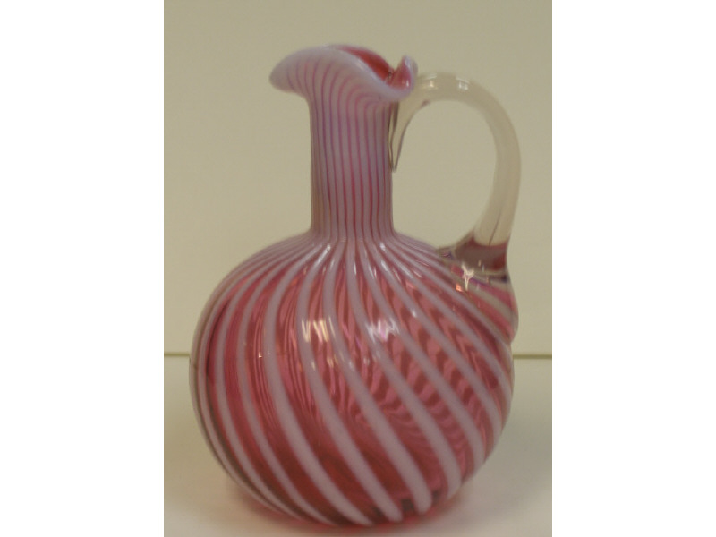 Appraisal: CRANBERRY GLASS CRUET Opalescent reverse swirl with applied clear handle