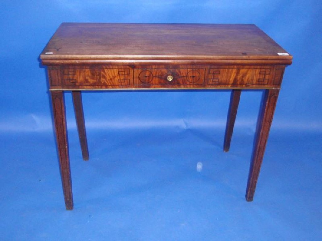 Appraisal: A George III mahogany tea table with rectangular folding top