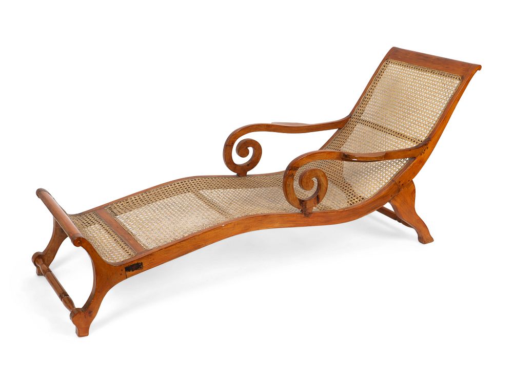 Appraisal: A British Colonial Caned Teak Chaise Longue Height x width