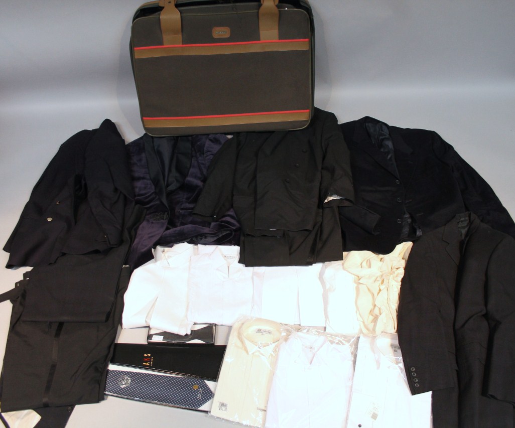 Appraisal: A Revelation canvas travel suitcase containing a quantity of gentleman's