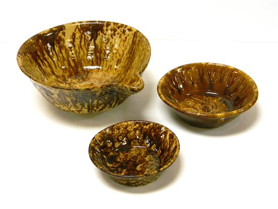 Appraisal: Three Rockingham glazed bowls including a batter bowl largest is