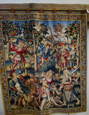 Appraisal: Woolworked tapestry depicting Medieval harvesting scene hung on brass rod