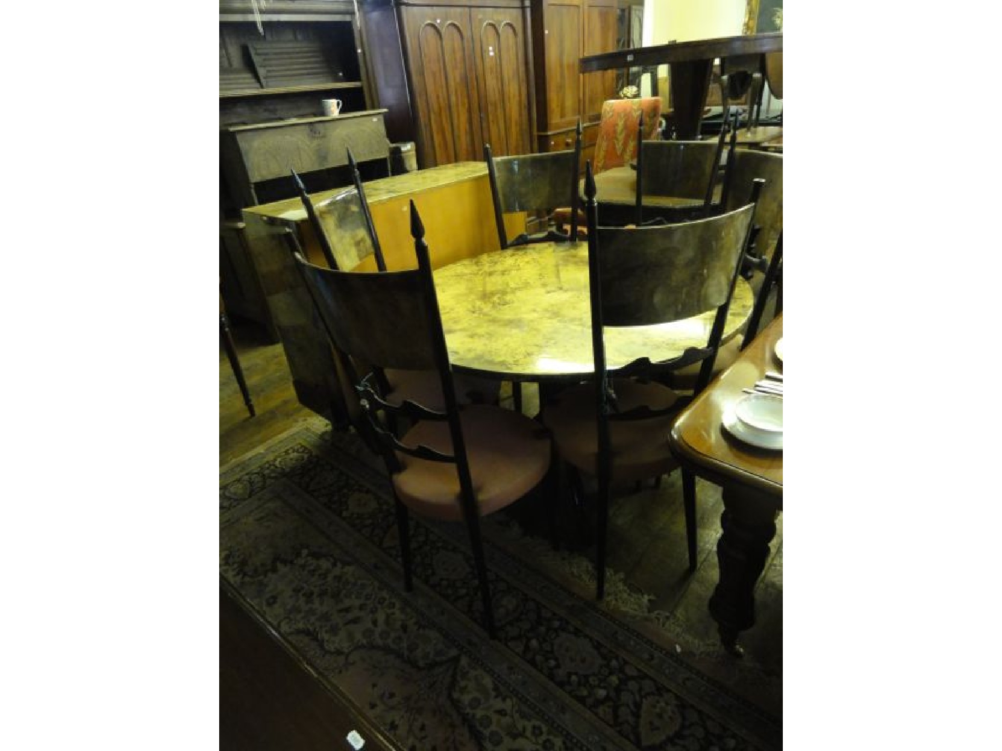 Appraisal: An Aldo Tura goat skin parchment dining room suite circa