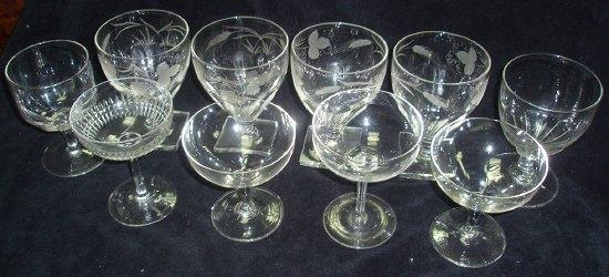 Appraisal: Four Victorian engraved goblets set on square bases together with